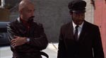 Sid Haig (t.v.) som én af mafiosoens henchmen Sid Haig (t.v.) som én af mafiosoens henchmen.