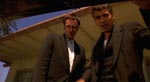 Richard og Seth Gecko (Quentin Tarantino og George Clooney) snakker til gidslet, som ligger i deres bagagerum.