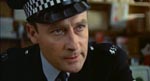 Sergeant Howie (Edward Woodward).