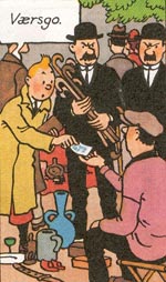 Tintin køber modelskibet på loppemarkedet.